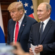 President Donald Trump (L) and Russian President Vladimir Putin arrive to waiting media during a joint press conference after their summit on July 16, 2018 in Helsinki, Finland.